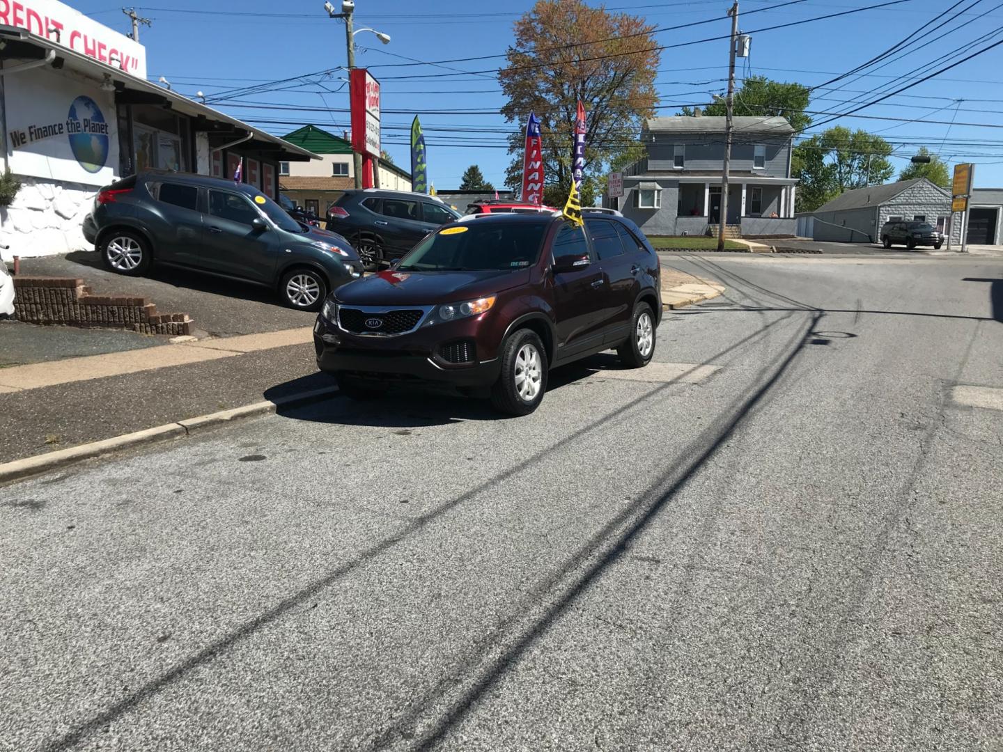 2012 Burgundy /Gray Kia Sorento LX (5XYKTDA29CG) with an 3.5 V6 engine, Automatic transmission, located at 577 Chester Pike, Prospect Park, PA, 19076, (610) 237-1015, 39.886154, -75.302338 - Photo#1